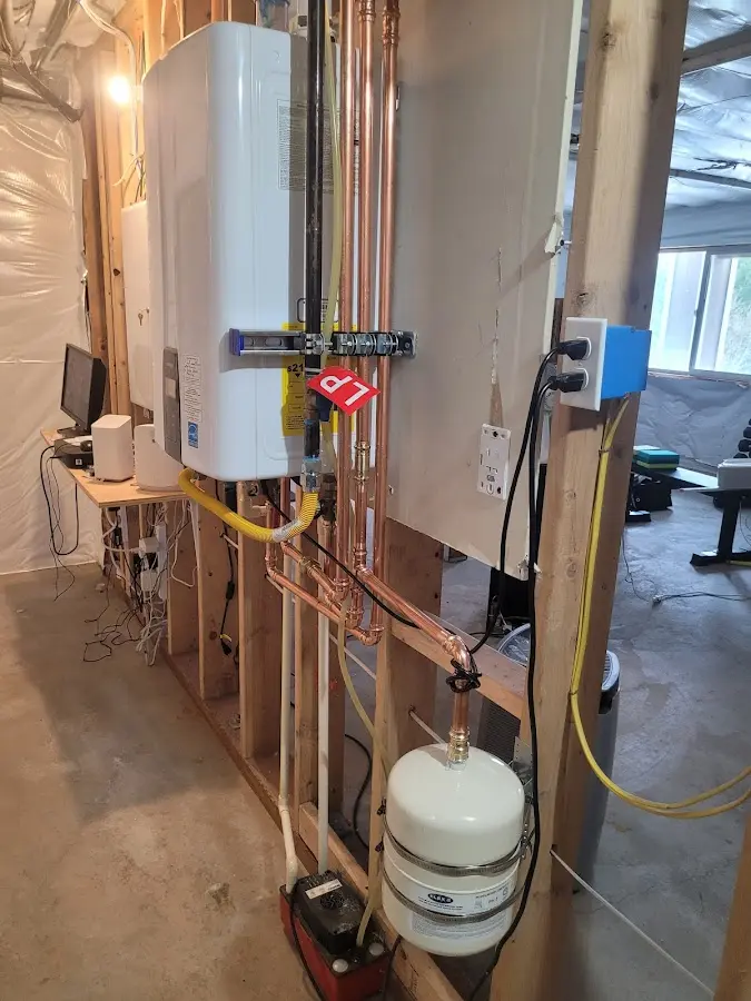 Licensed plumber repairing a kitchen sink in Fairview
